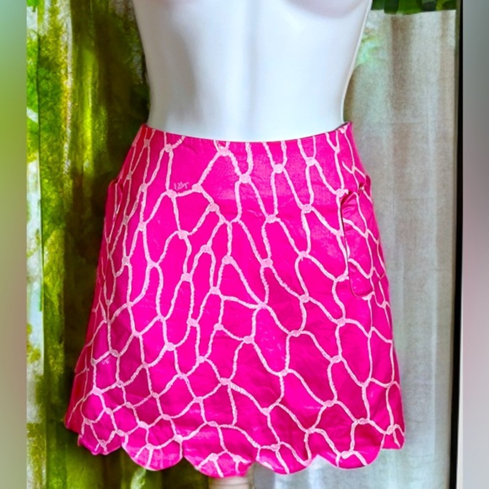 Lilly Pulitzer pink mini skirt with linens shorts underneath